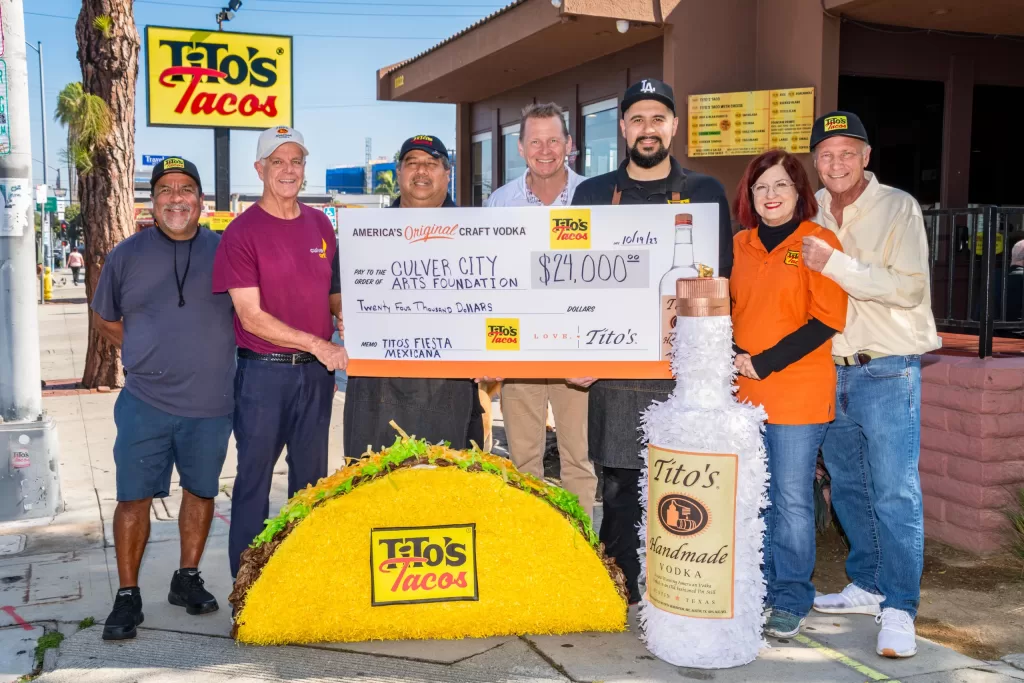 Representatives of Tito&rsquo;s Tacos and Tito&rsquo;s Handmade Vodka present an oversized $24,000 check to the Culver City Arts Foundation
